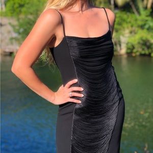 Calvin Klein black dress with fringe detailing.

Condition: Excellent.